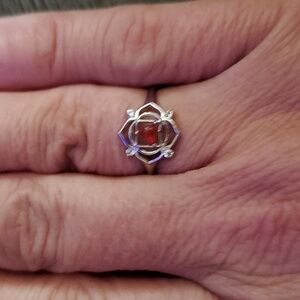 STERLING SILVER WITH REDDISH ORANGY STONE